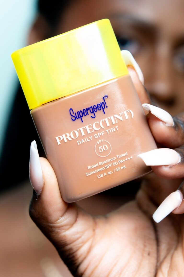 Holding Supergoop Protectint