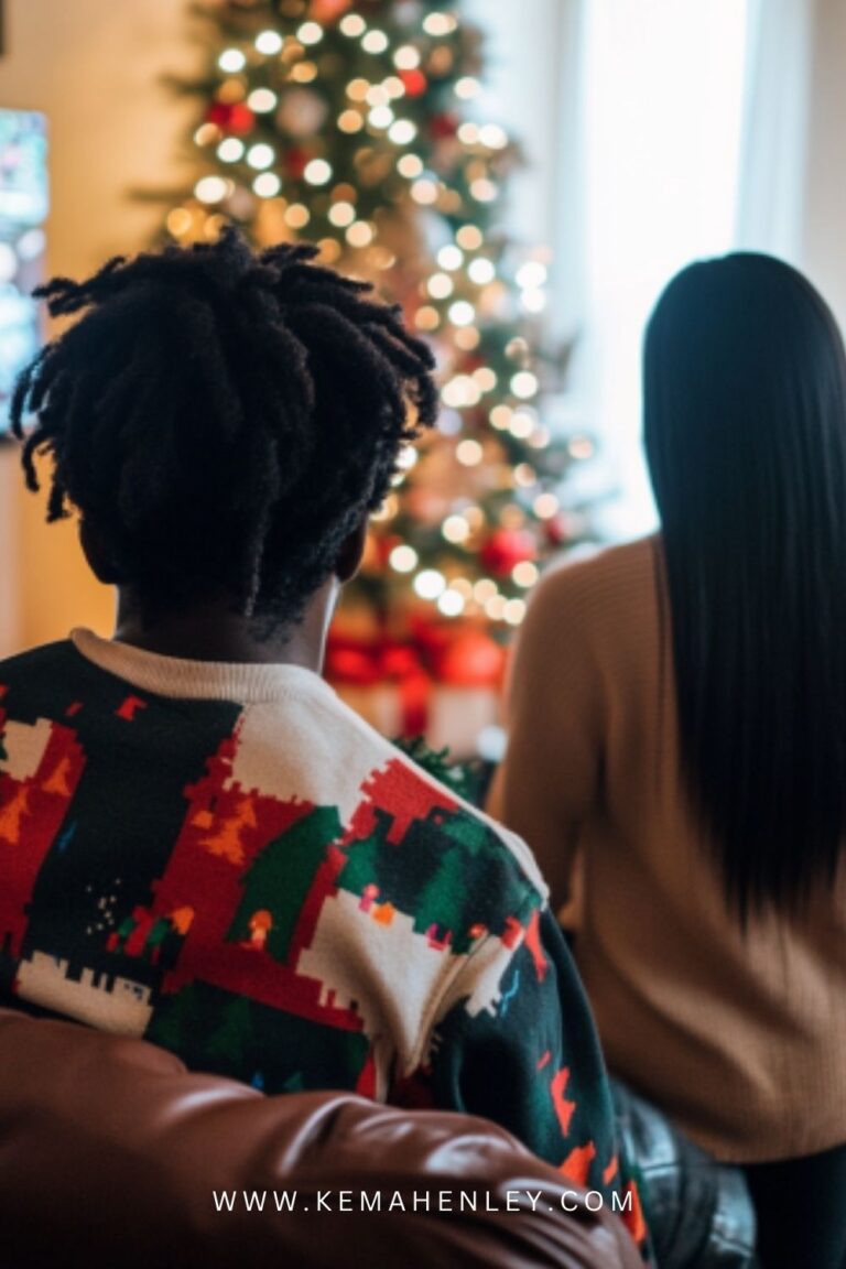 a man and woman sitting in front of a christmas tree