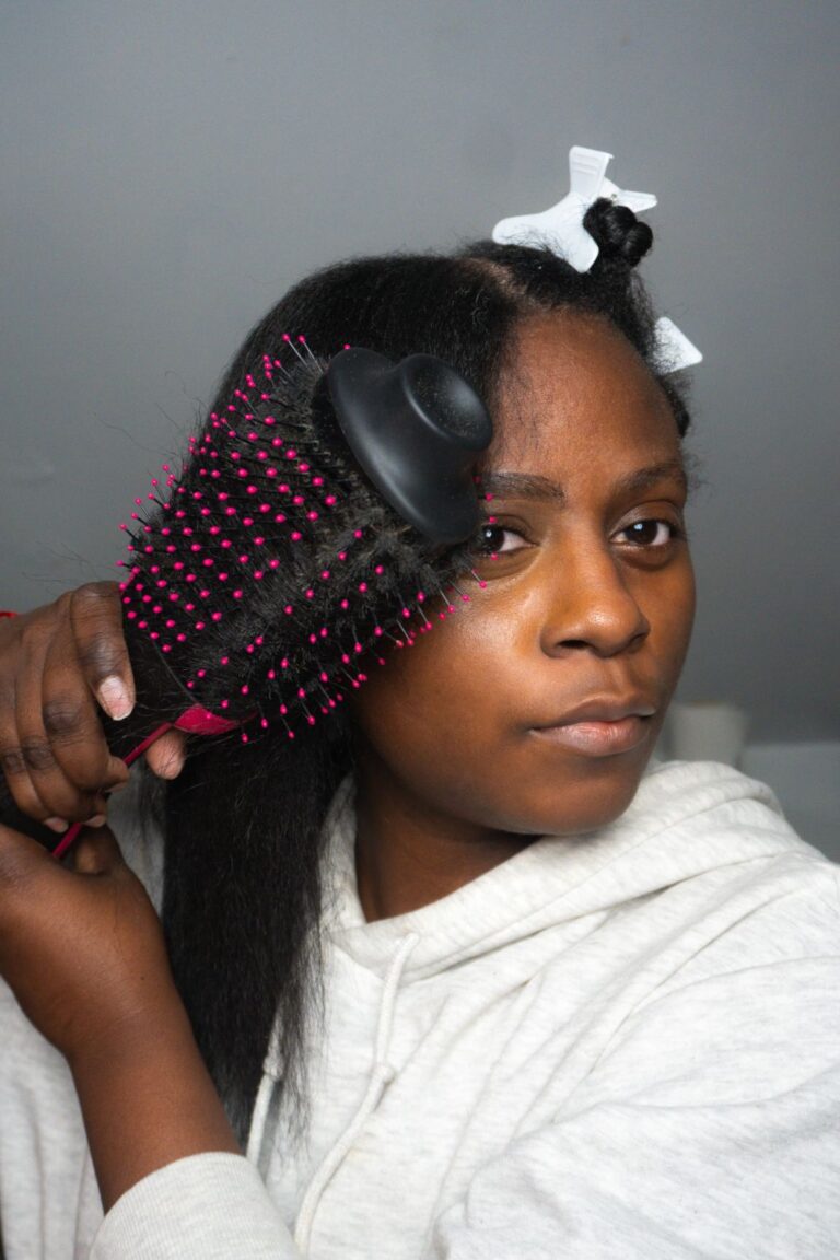 a woman brushing her hair