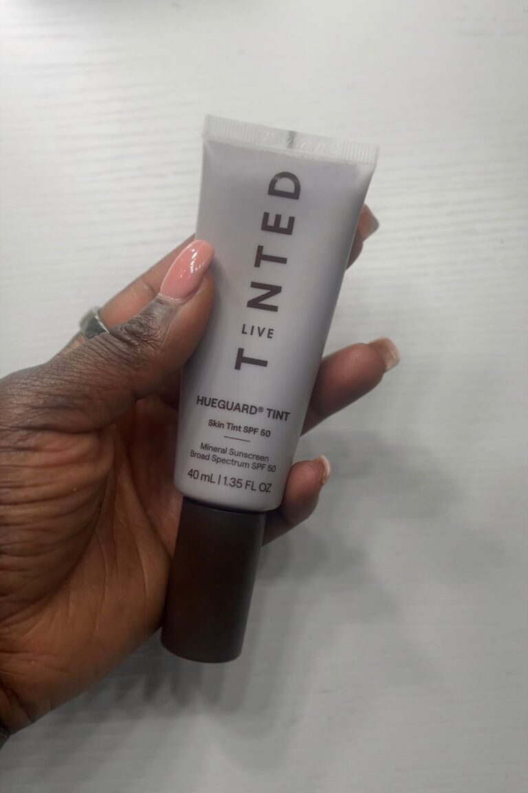 Holding a tube of sunscreen